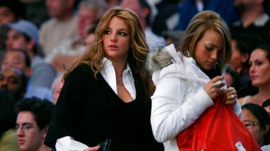 The two Spears sisters are pictured at a basket ball game together in Los Angeles in 2006. Pic: AP